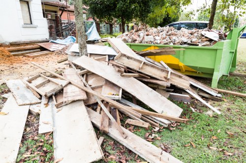 Loft clearance professionals working in a Poplar home